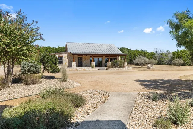 a bathroom with a double vanity sink a mirror a vanity and a shower