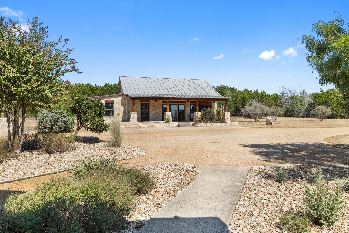 1120 Canyon View Road Dripping Springs, TX 78620 - Photo 25 of 40 a swimming pool with trees in front of it