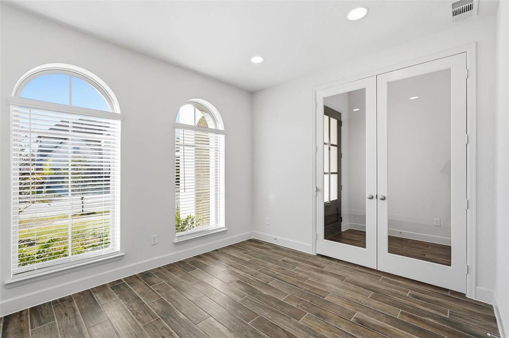 3329 Lacebark Lane Celina, TX 75009 - Photo 13 of 35 a view of empty room with wooden floor and fan