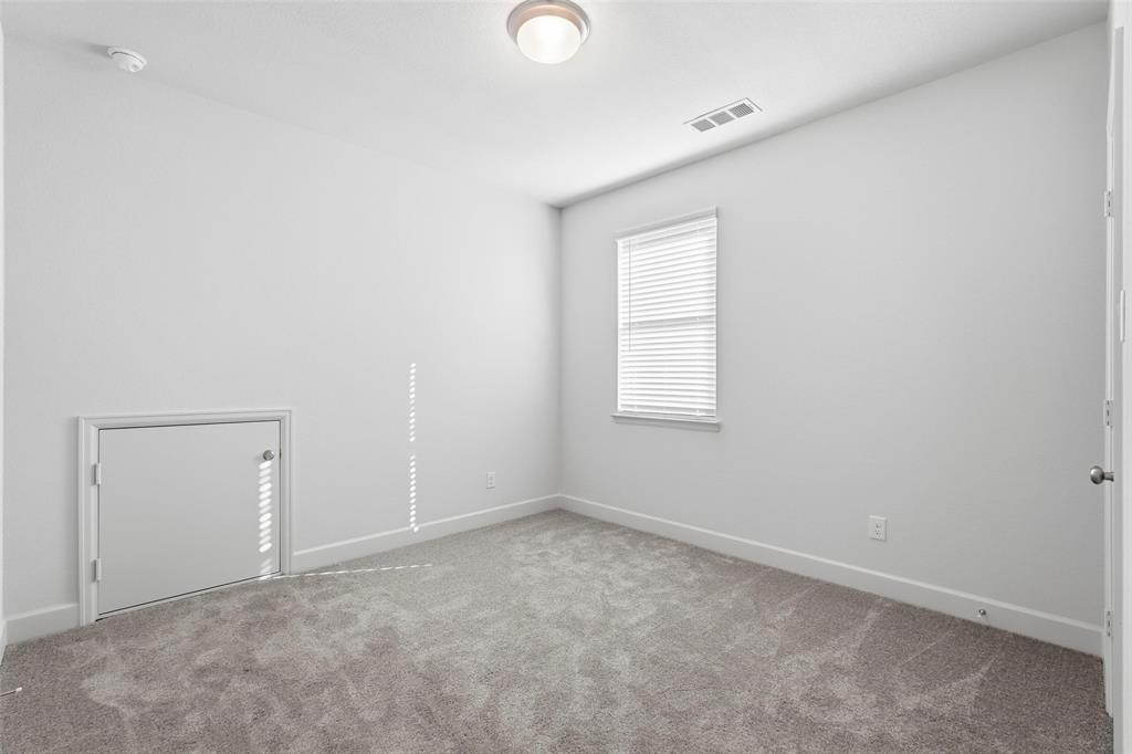 3329 Lacebark Lane Celina, TX 75009 - Photo 18 of 35 an empty room with windows and closet