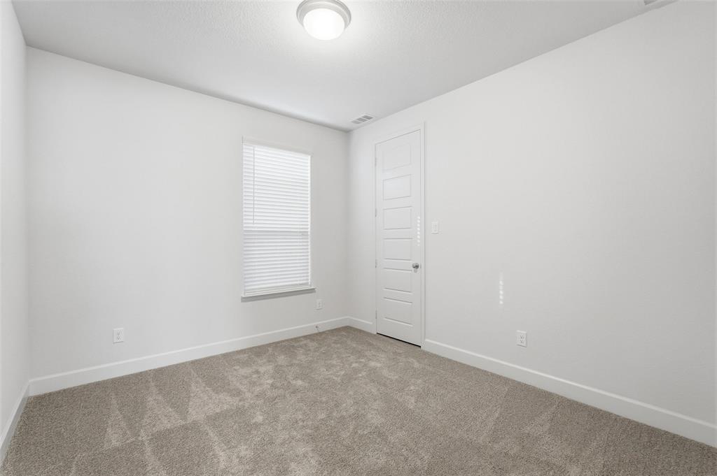 3329 Lacebark Lane Celina, TX 75009 - Photo 19 of 35 an empty room with a window