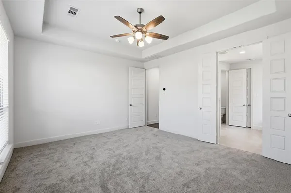 a bathroom with a toilet a sink and a mirror