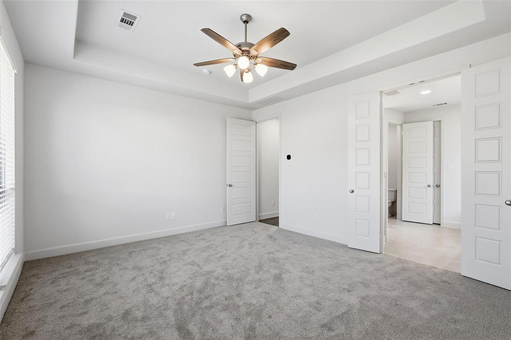 3329 Lacebark Lane Celina, TX 75009 - Photo 21 of 35 an empty room with ceiling fan and window