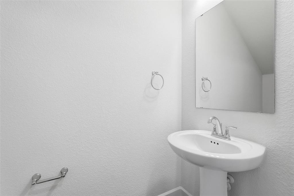 3329 Lacebark Lane Celina, TX 75009 - Photo 26 of 35 a sink with a mirror