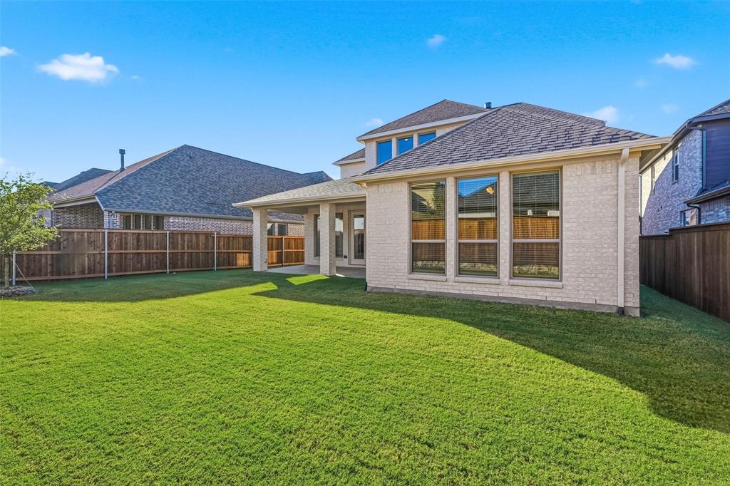 3329 Lacebark Lane Celina, TX 75009 - Photo 30 of 35 a front view of a house with a garden