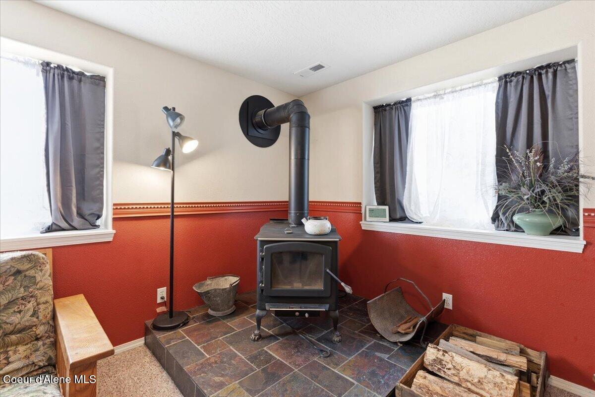 222 East Remington Road Athol, ID 83801 - Photo 50 of 78 Cozy wood stove in rec room