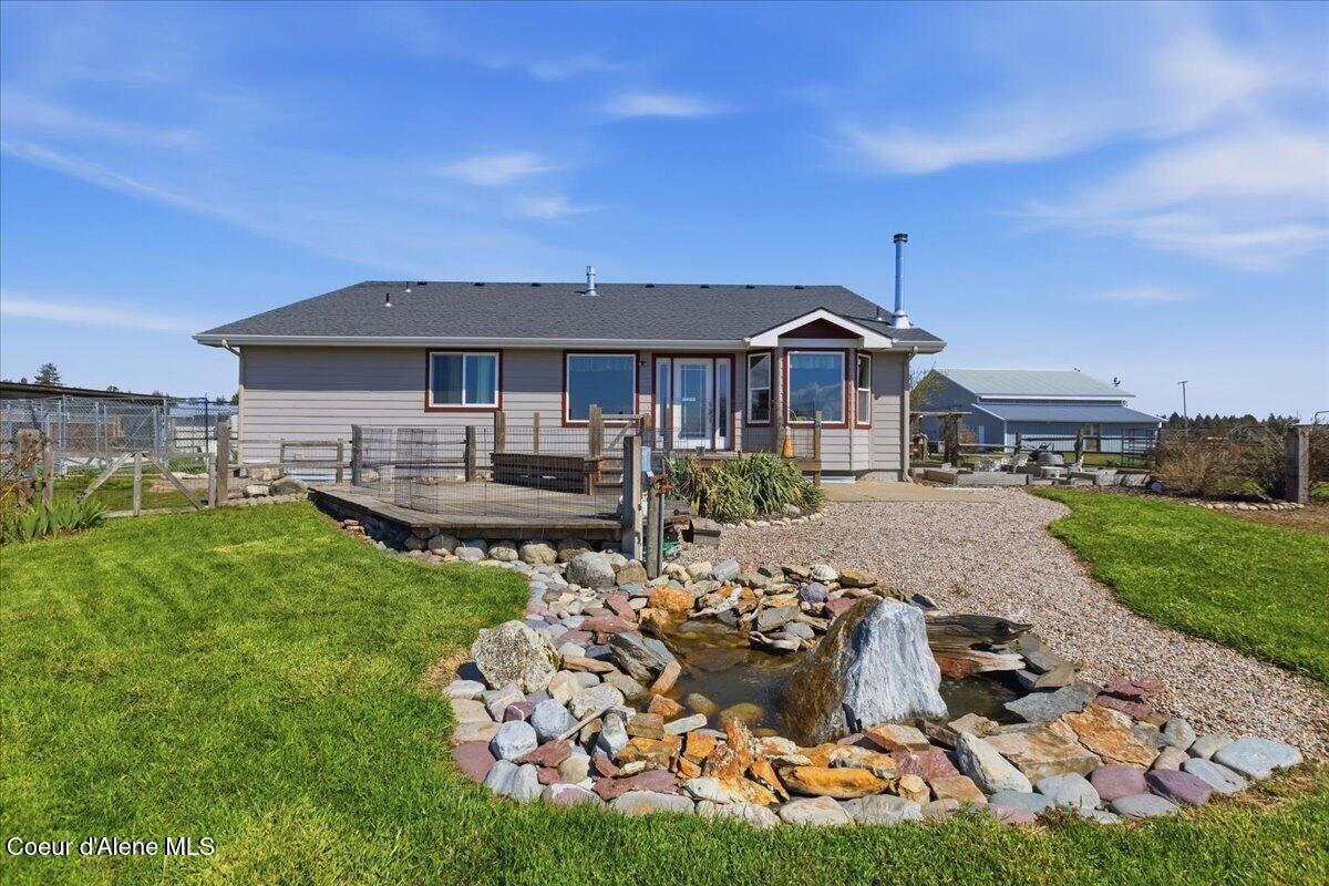 222 East Remington Road Athol, ID 83801 - Photo 59 of 78 Water Feature and Back of Home