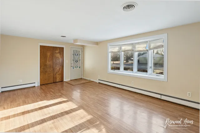 a view of livingroom with hardwood floor and a ceiling fan