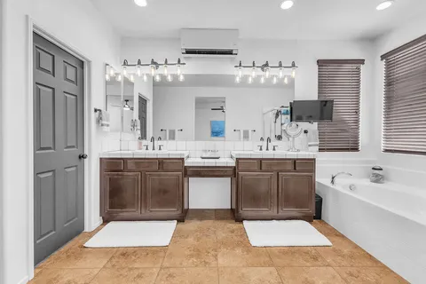 a bedroom with bed and a window