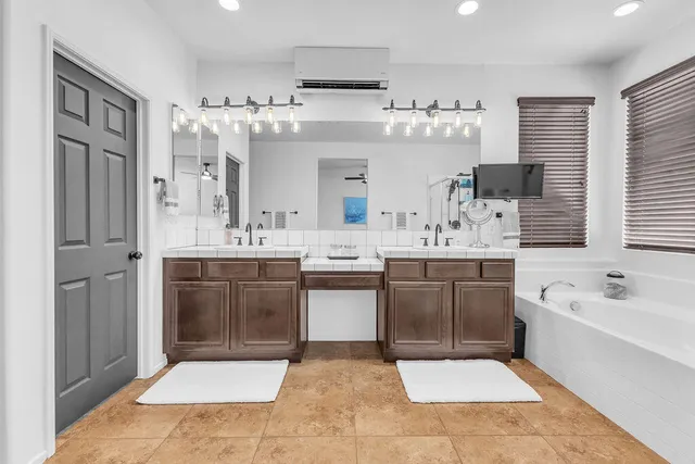 a bedroom with bed and a window