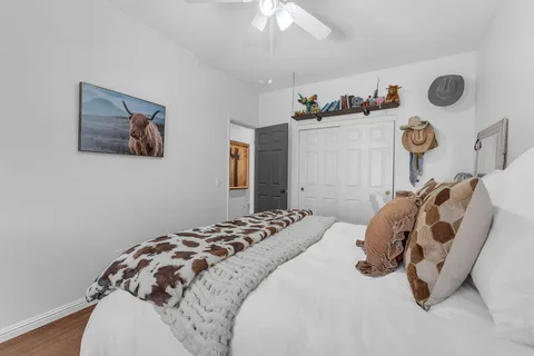 a view of a patio with table and chairs with wooden floor and fence