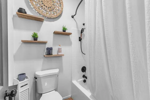 a view of a chair and tables in the patio
