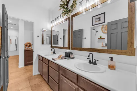 a view of a patio with table and chairs and potted plants