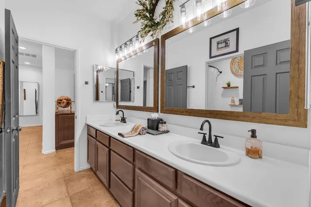 a view of a patio with table and chairs and potted plants