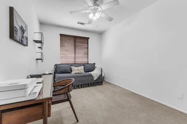 an aerial view of a house with a garden and plants
