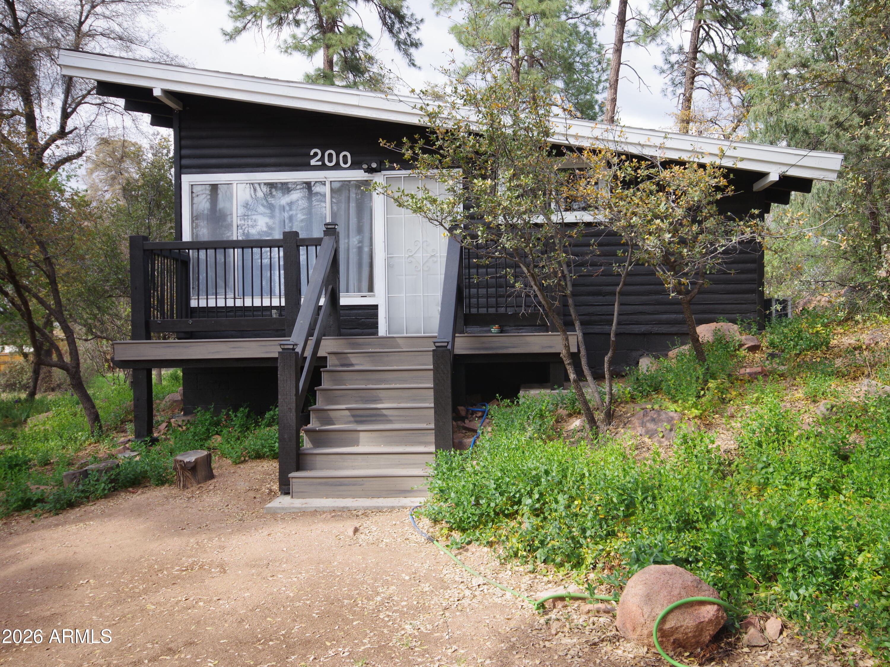 200 East Frontier Street Payson, AZ 85541 - Photo 1 of 8 a front view of a house with plants