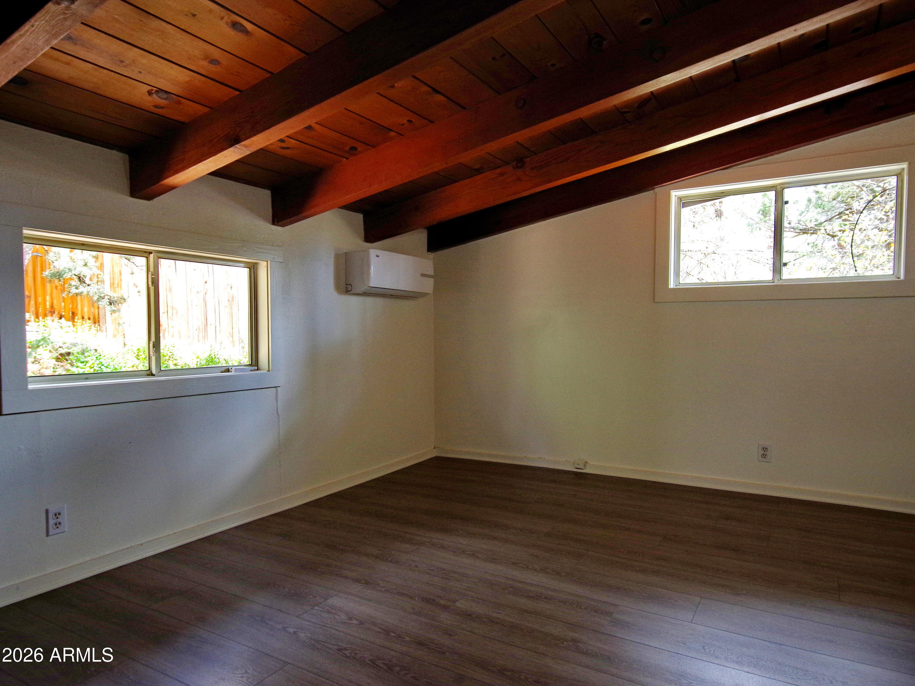 200 East Frontier Street Payson, AZ 85541 - Photo 4 of 8 a view of empty room with wooden floor and fan