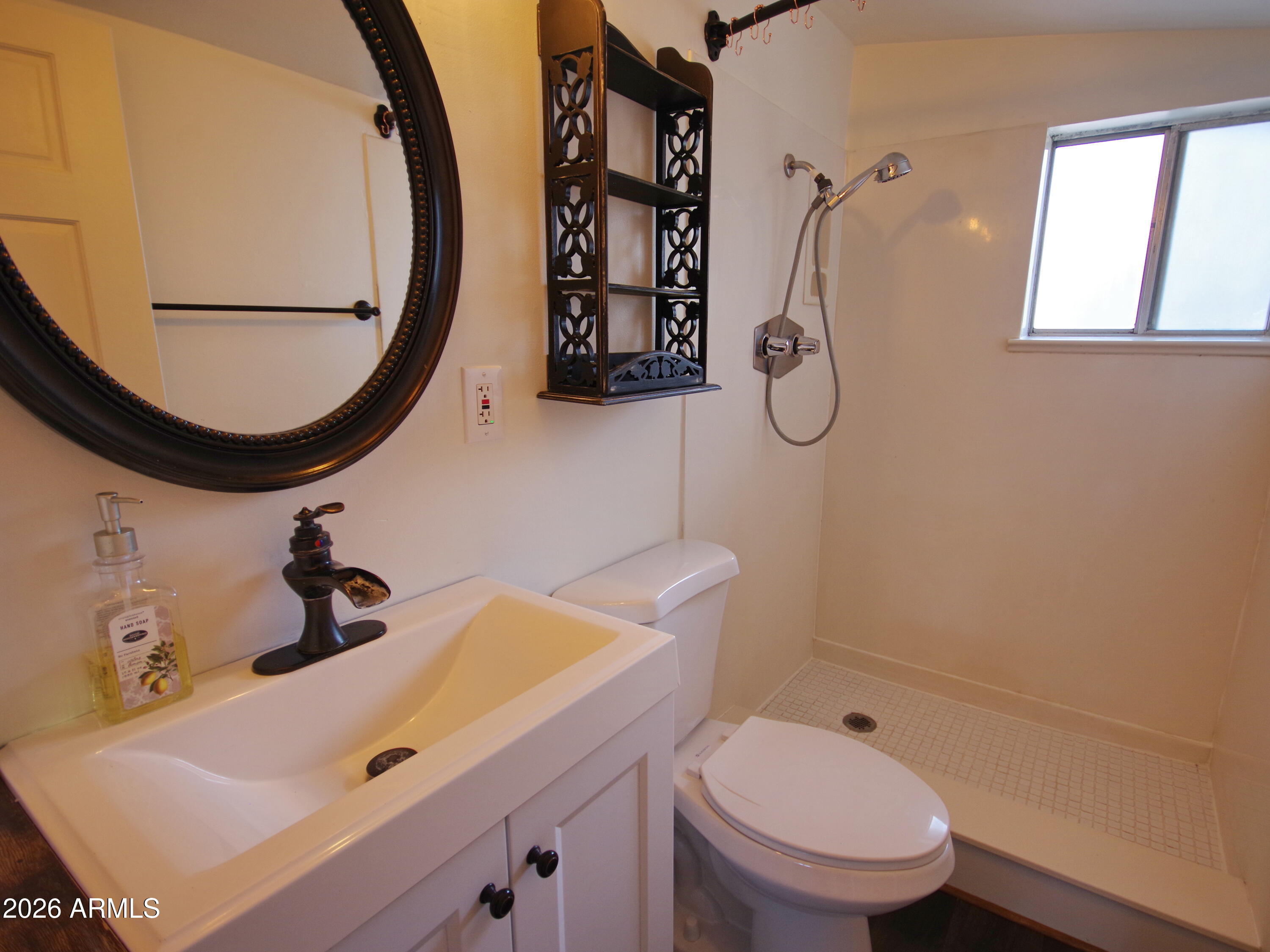 200 East Frontier Street Payson, AZ 85541 - Photo 6 of 8 a bathroom with a sink toilet and mirror