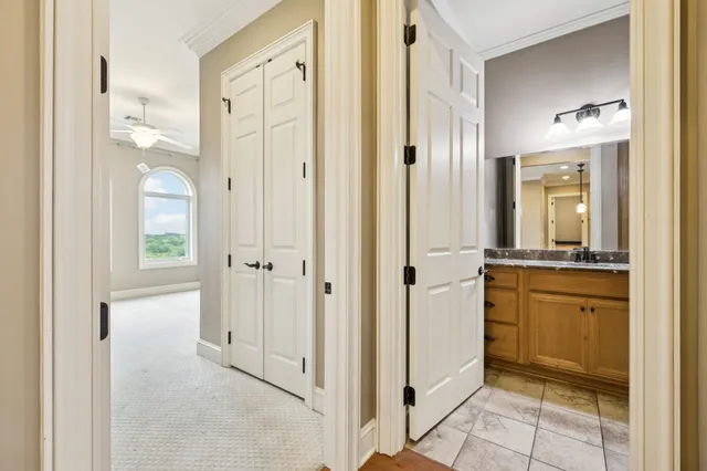 a bathroom with a granite countertop sink mirror and a bathtub