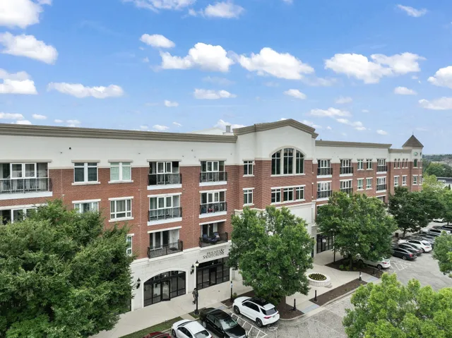 a view of multiple houses with a yard