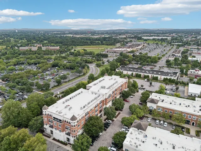 an aerial view of a multi story parking space