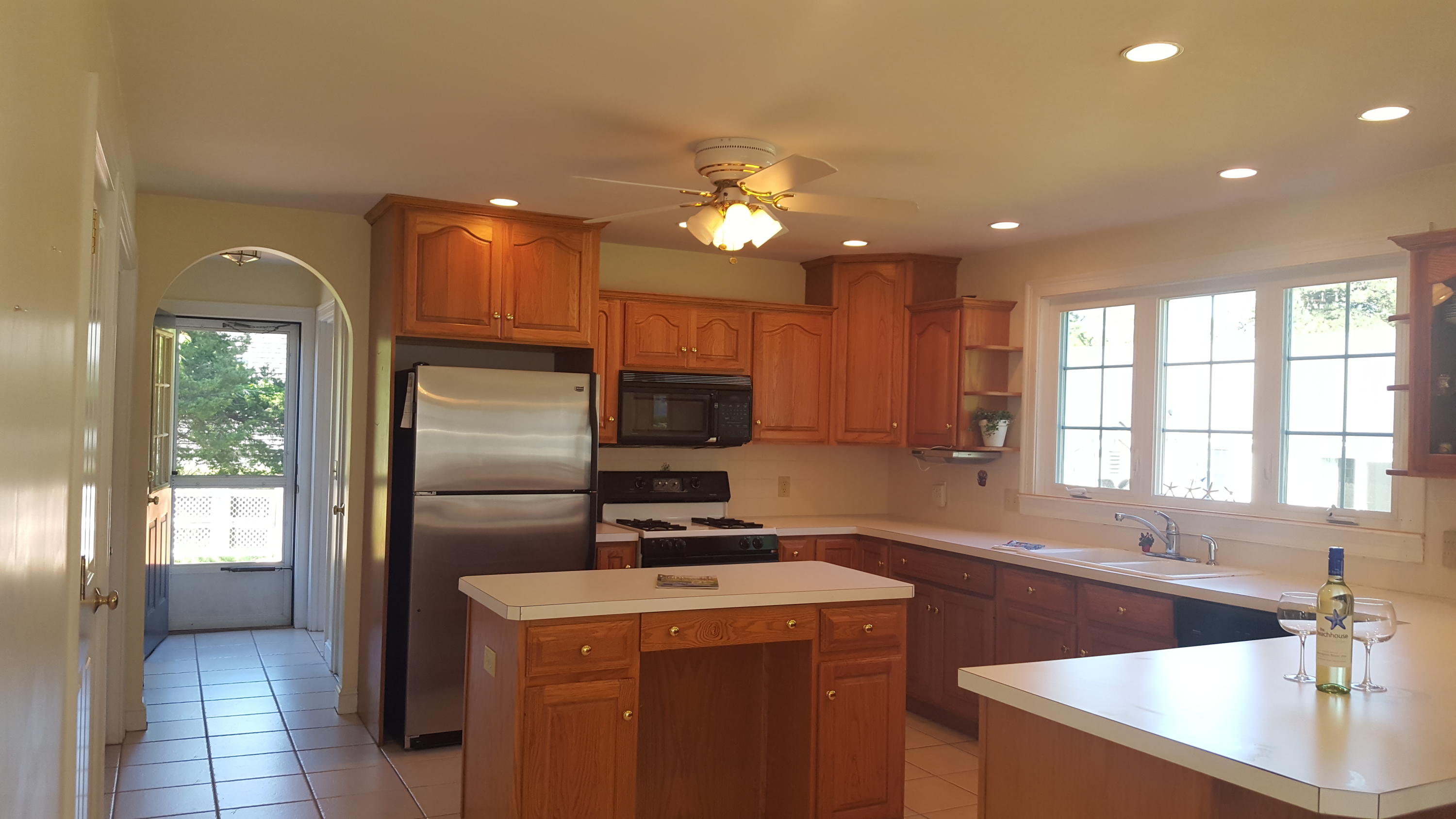 14 Bain Road Dennis Port, MA 02639 - Photo 2 of 22 a kitchen with a sink a counter top space cabinets and stainless steel appliances