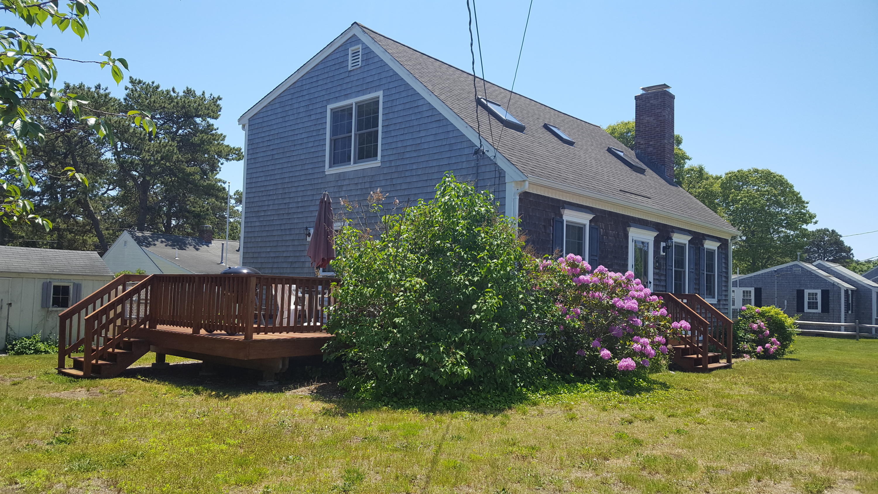14 Bain Road Dennis Port, MA 02639 - Photo 21 of 22 a view of a house with backyard and sitting area
