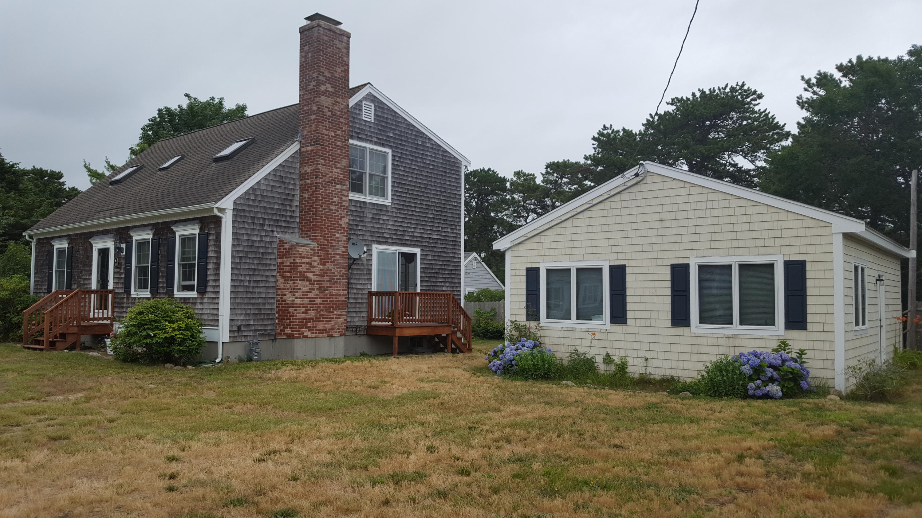 14 Bain Road Dennis Port, MA 02639 - Photo 22 of 22 front view of a house with a yard