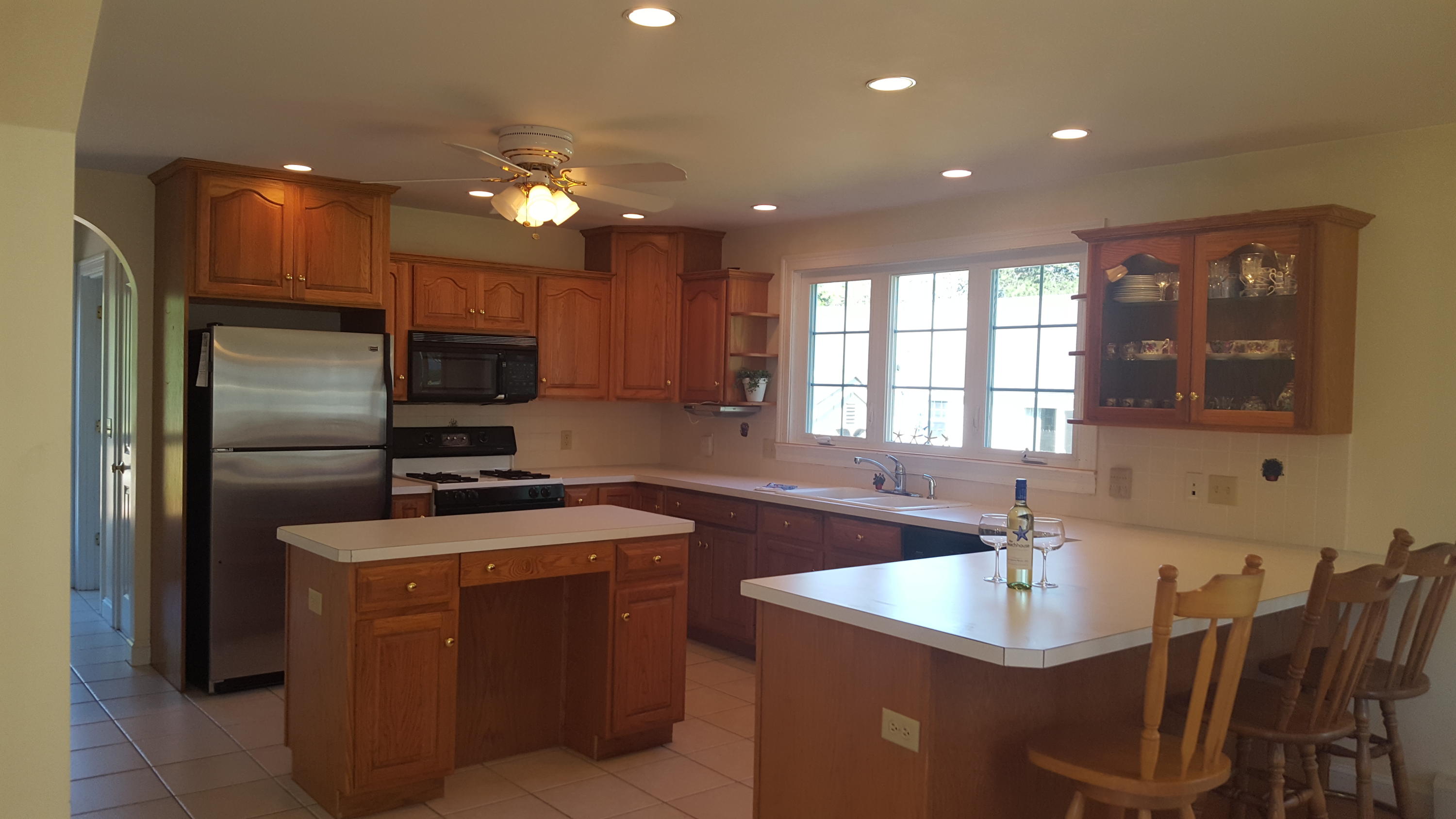 14 Bain Road Dennis Port, MA 02639 - Photo 3 of 22 a kitchen with kitchen island a sink stainless steel appliances and window