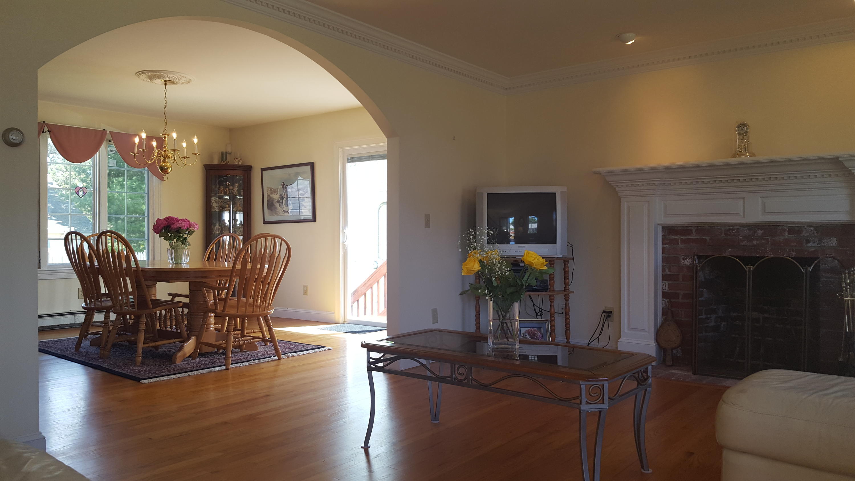 14 Bain Road Dennis Port, MA 02639 - Photo 7 of 22 a view of a dining room with furniture wooden floor and chandelier