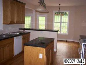 842 Linneys Mill Road Union Grove, NC 28689 - Photo 8 of 8 a kitchen that has a sink and a stove