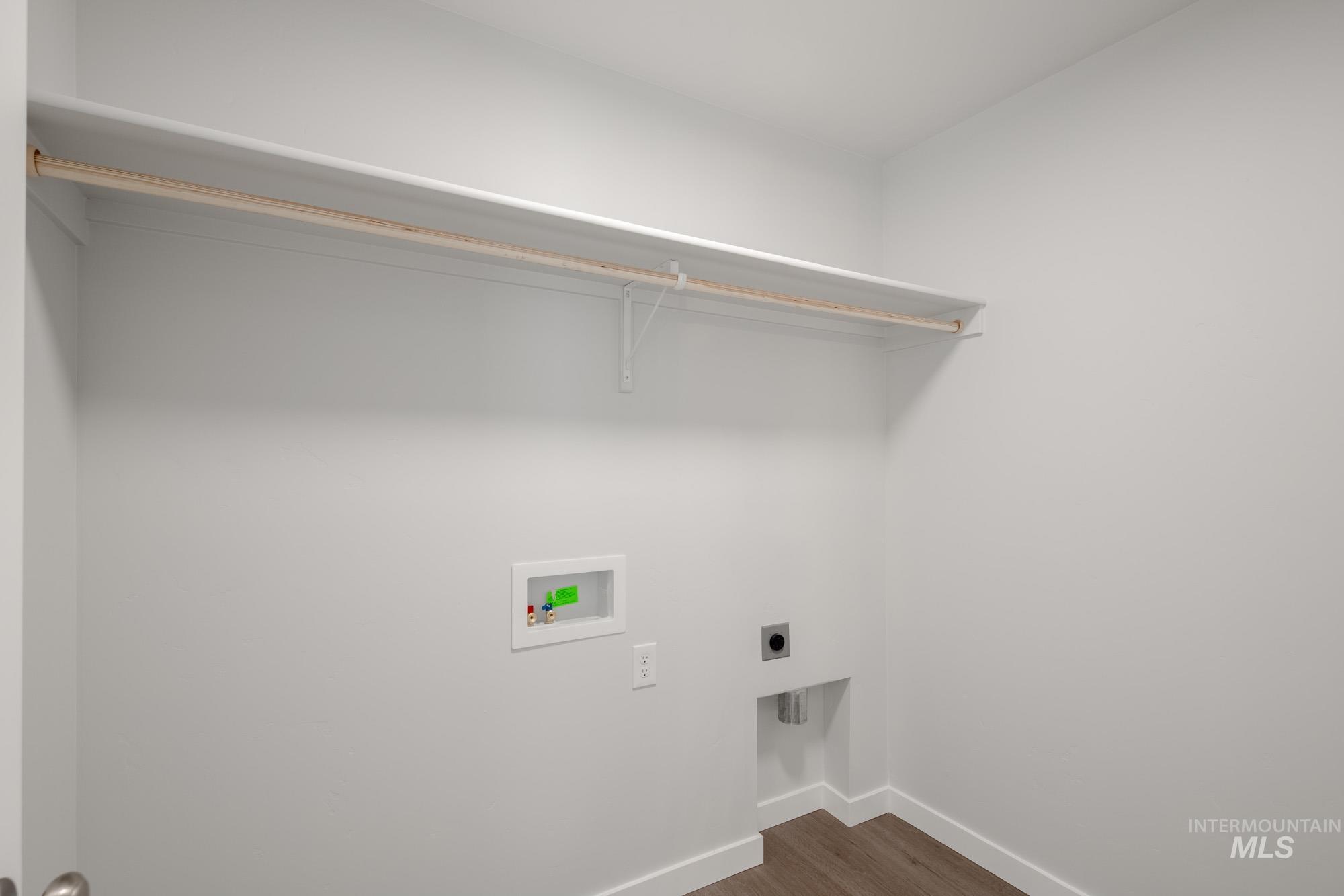 910 North Mirror Creek Way Meridian, ID 83642 - Photo 25 of 27 Washroom featuring dark wood finished floors, hookup for a washing machine, and electric dryer hookup