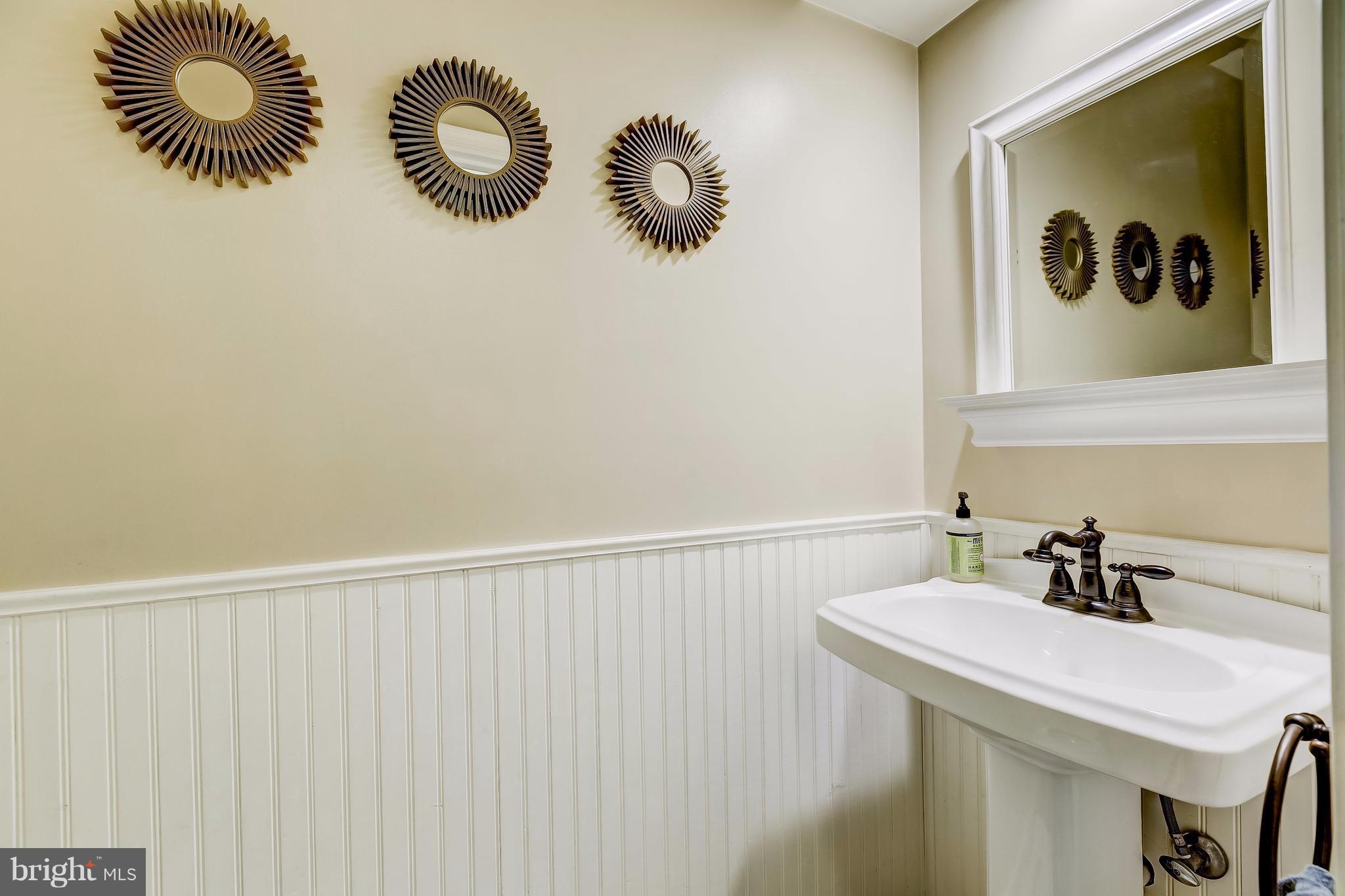 285 Locust Ridge Lane Arnold, MD 21012 - Photo 12 of 24 a bathroom with a sink and a mirror