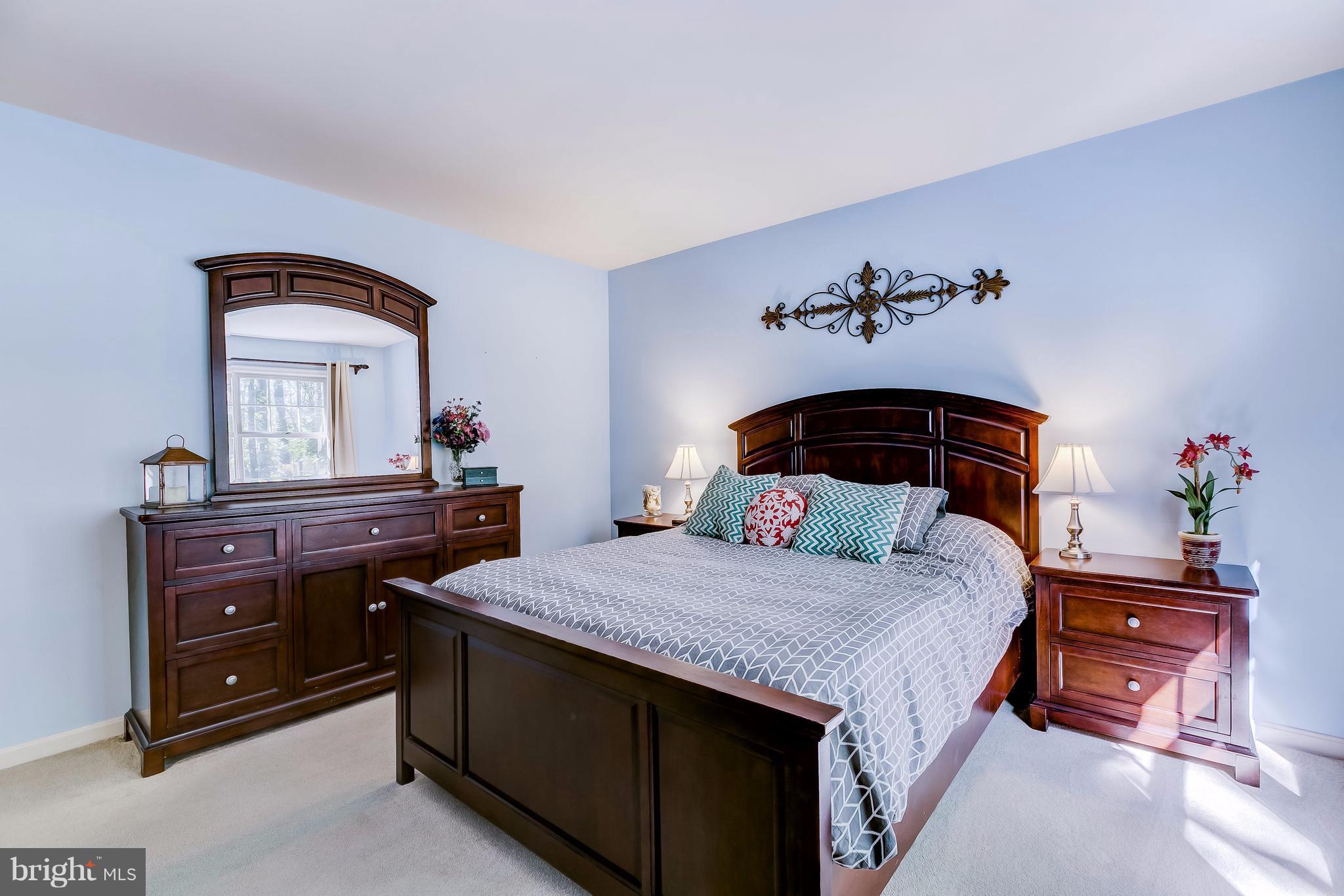 285 Locust Ridge Lane Arnold, MD 21012 - Photo 13 of 24 a bedroom with a bed and a dresser