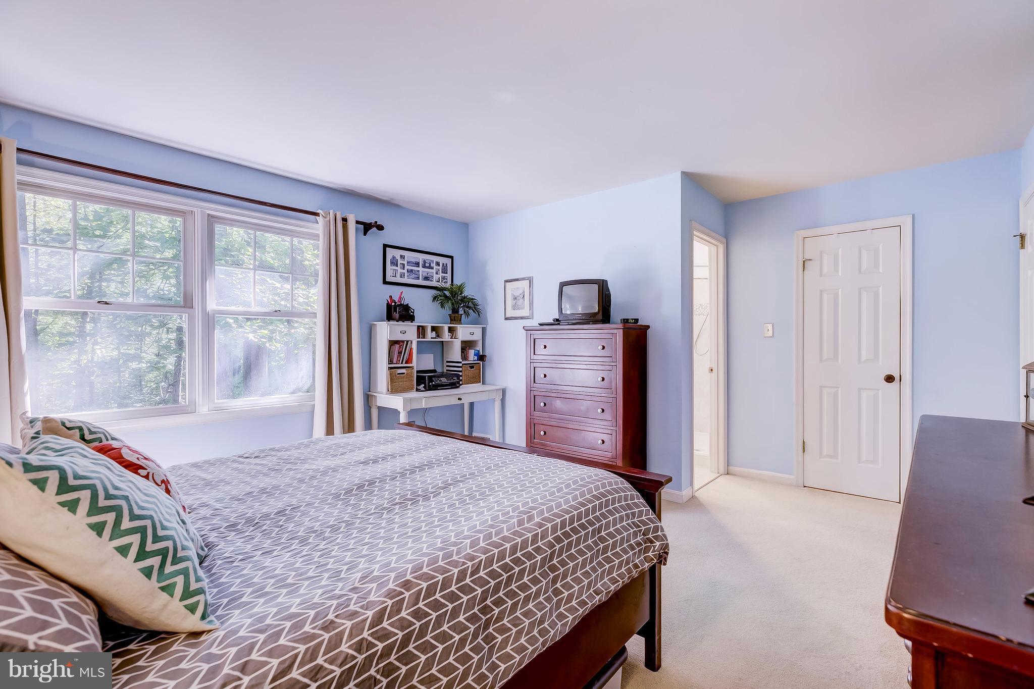 285 Locust Ridge Lane Arnold, MD 21012 - Photo 14 of 24 a bedroom with a bed and a large window