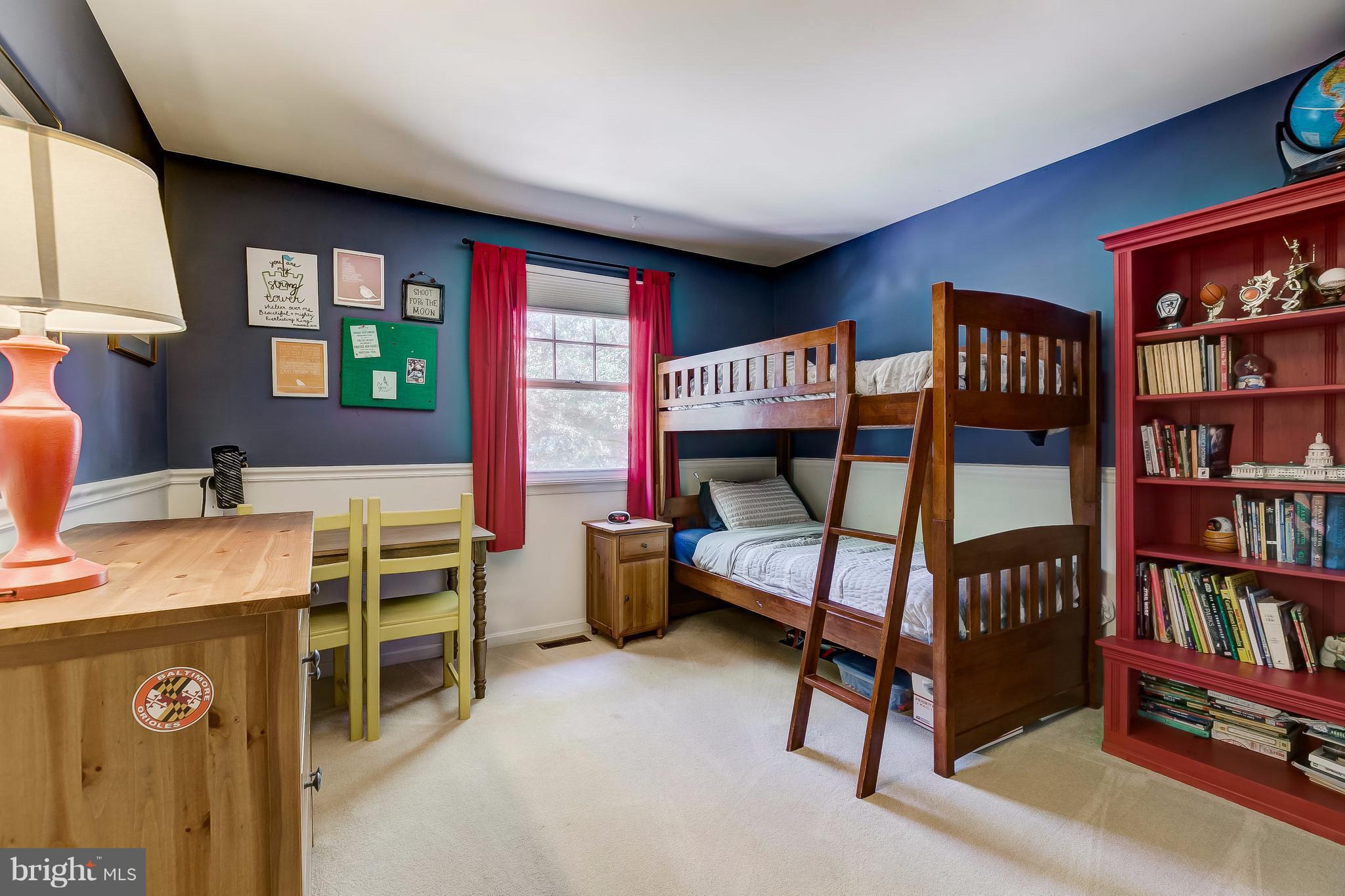 285 Locust Ridge Lane Arnold, MD 21012 - Photo 18 of 24 a bedroom with furniture and a book shelf