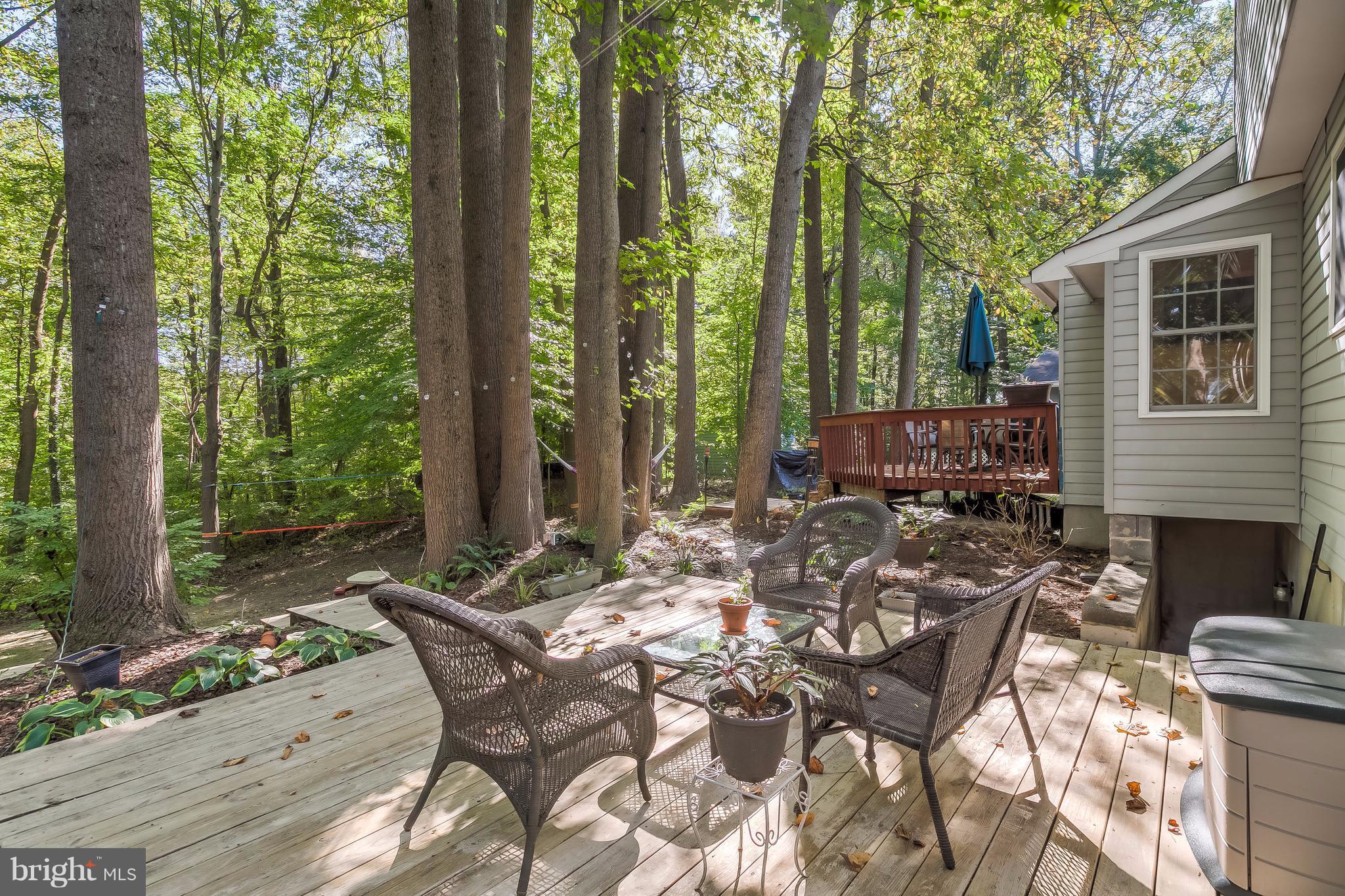 285 Locust Ridge Lane Arnold, MD 21012 - Photo 22 of 24 a view of a patio with table and chairs and wooden fence