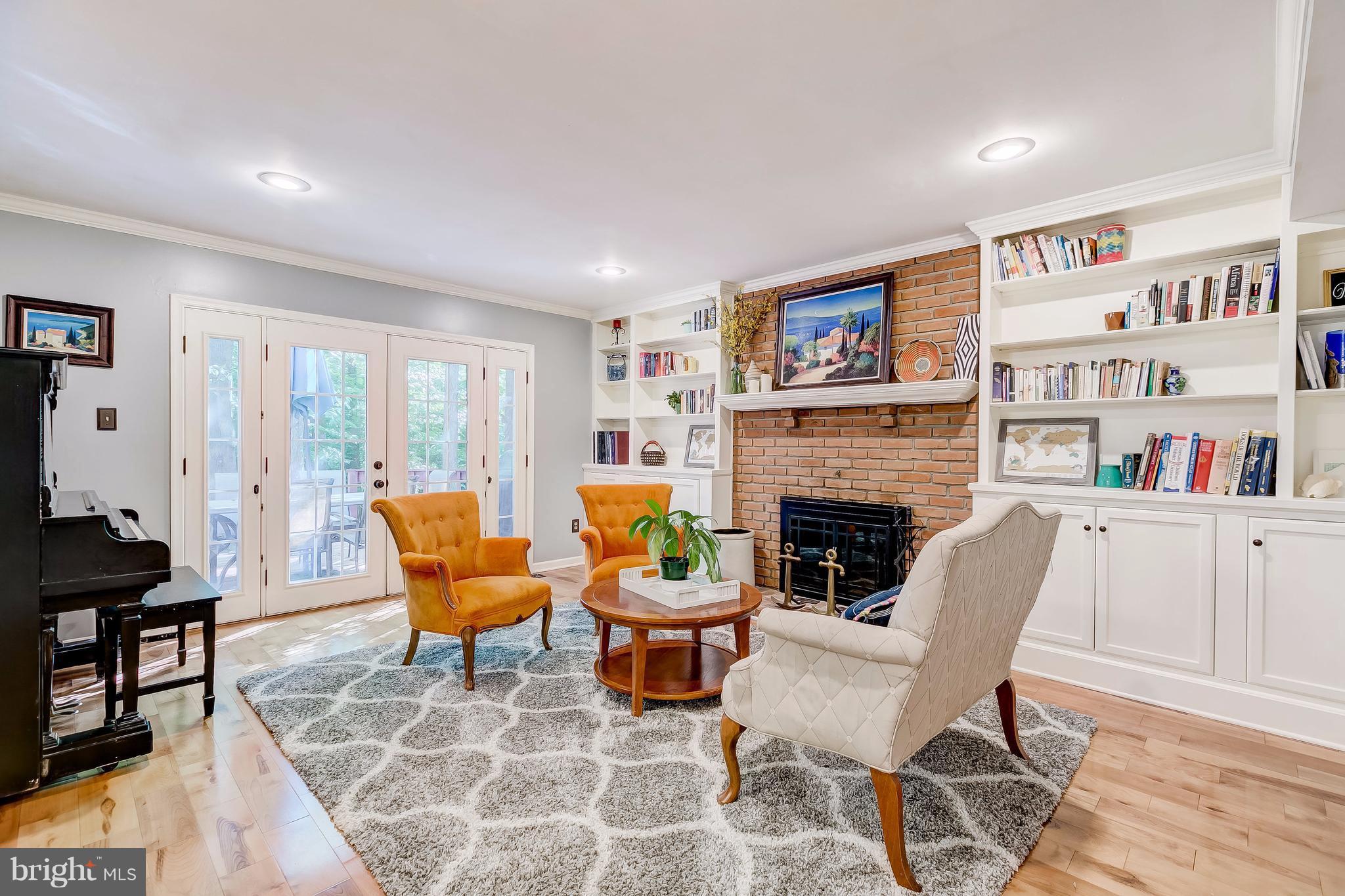 285 Locust Ridge Lane Arnold, MD 21012 - Photo 7 of 24 a living room with furniture a fireplace and a large window