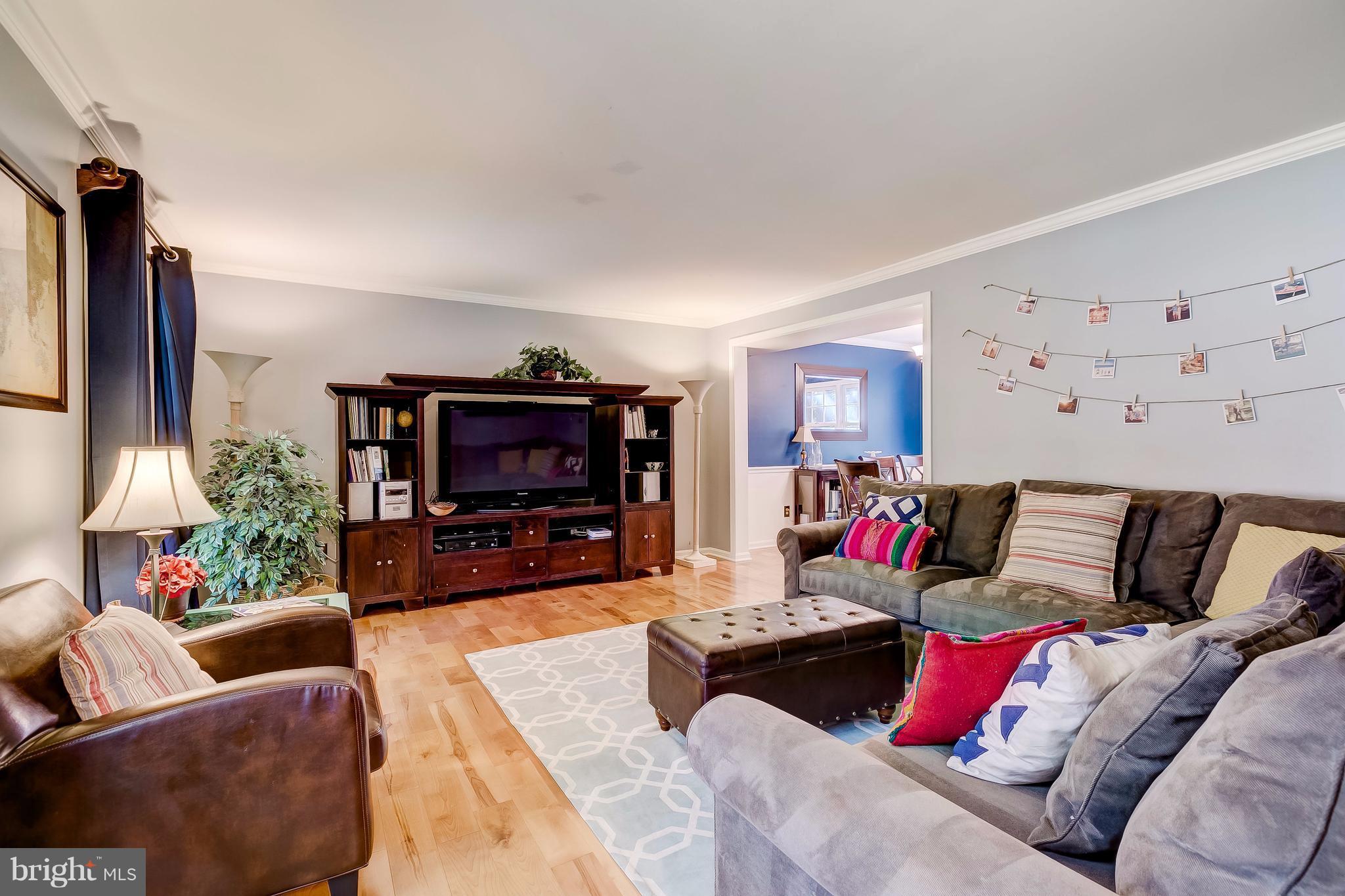 285 Locust Ridge Lane Arnold, MD 21012 - Photo 8 of 24 a living room with furniture and a flat screen tv