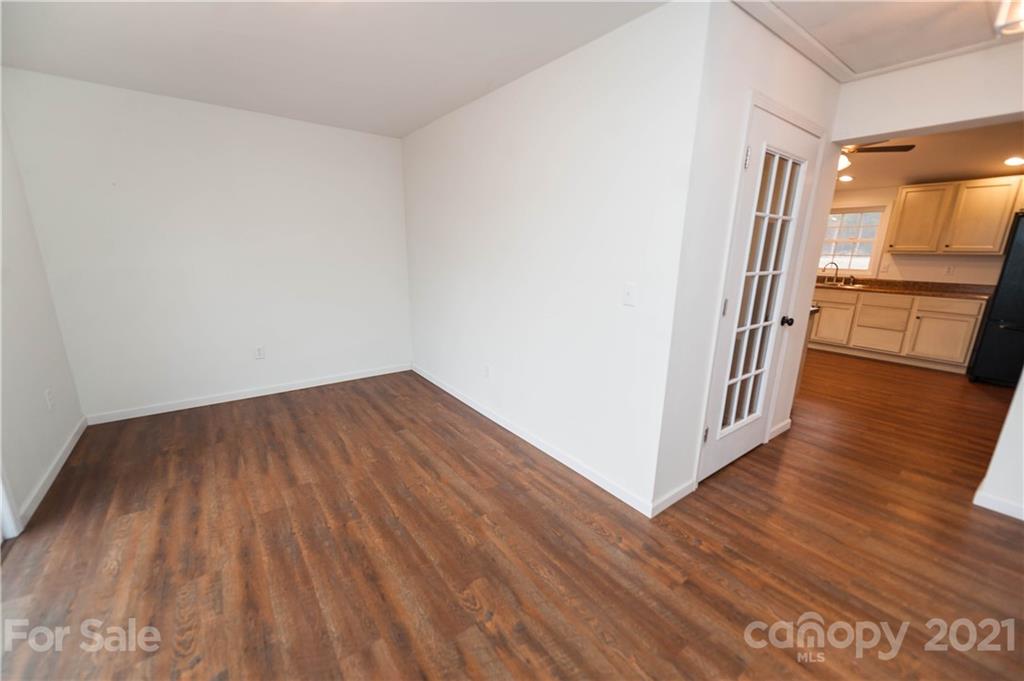 4266 Big Island Road Rutherfordton, NC 28139 - Photo 14 of 36 a view of a hallway with wooden floor