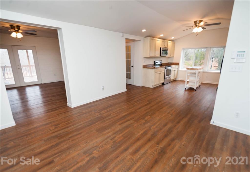 4266 Big Island Road Rutherfordton, NC 28139 - Photo 8 of 36 a view of a kitchen with wooden floor and a kitchen