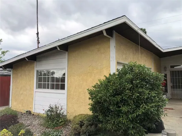 a house with trees in front of it