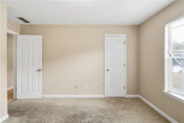 an empty room with windows