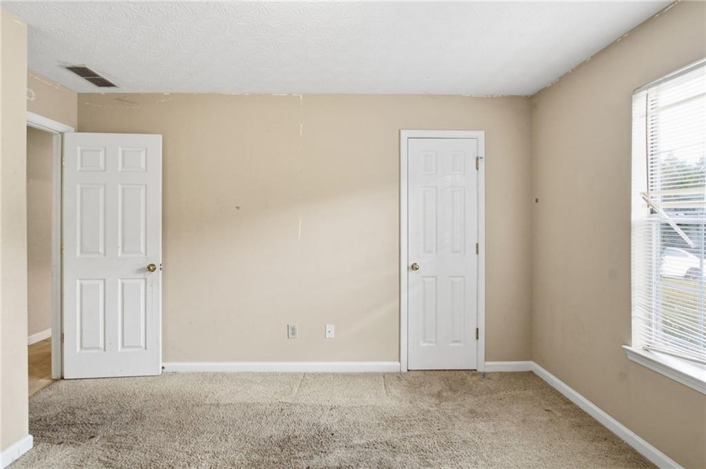 115 Mountainview Drive Covington, GA 30016 - Photo 11 of 22 an empty room with windows