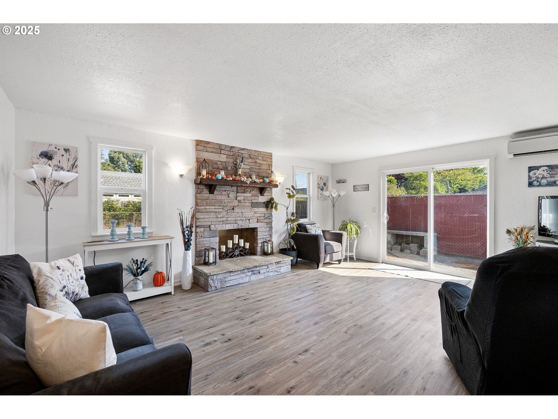 2105 16th Street Florence, OR 97439 - Photo 15 of 48 a living room with furniture and a fireplace
