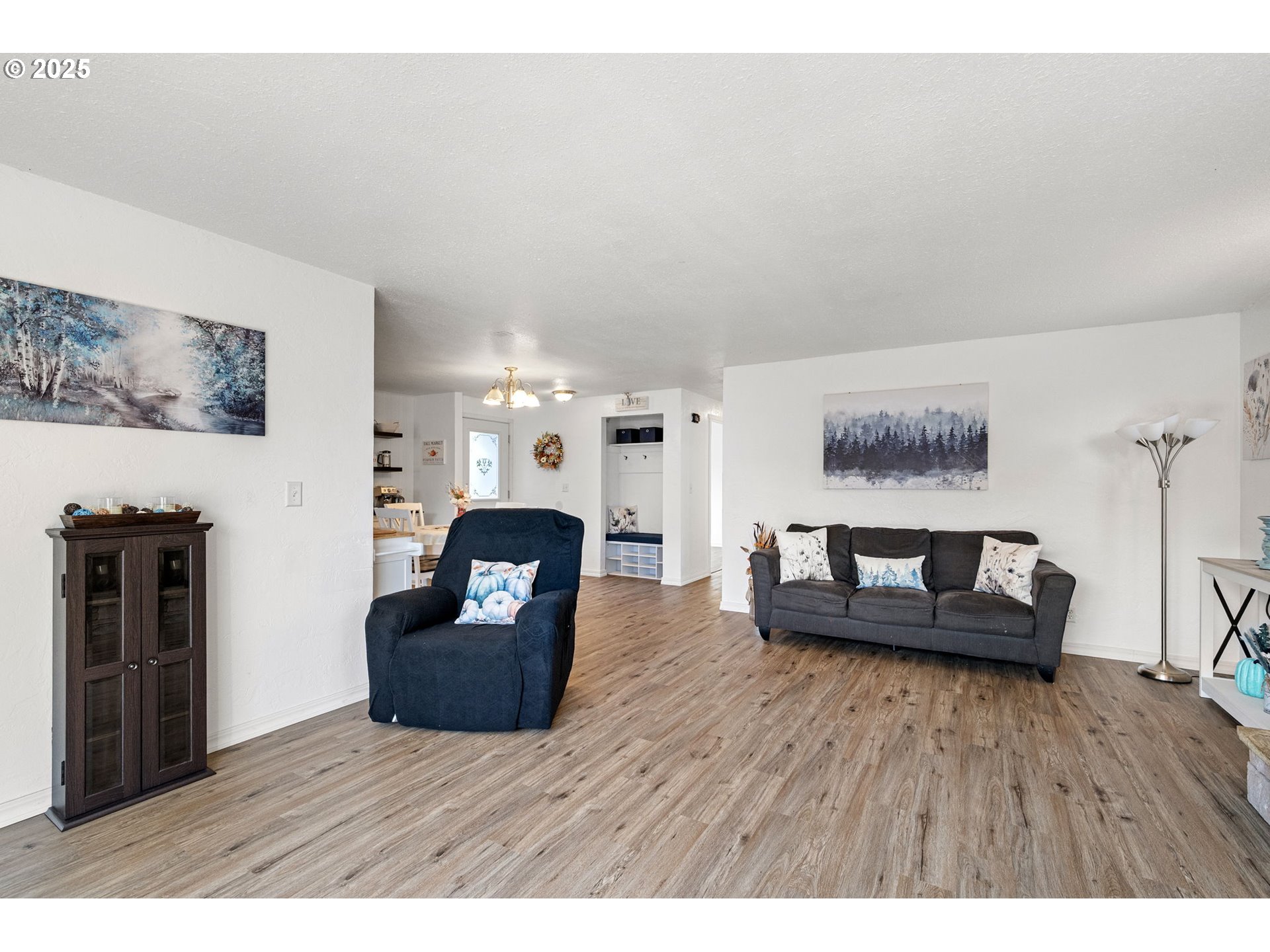 2105 16th Street Florence, OR 97439 - Photo 19 of 48 a living room with furniture and a wooden floor