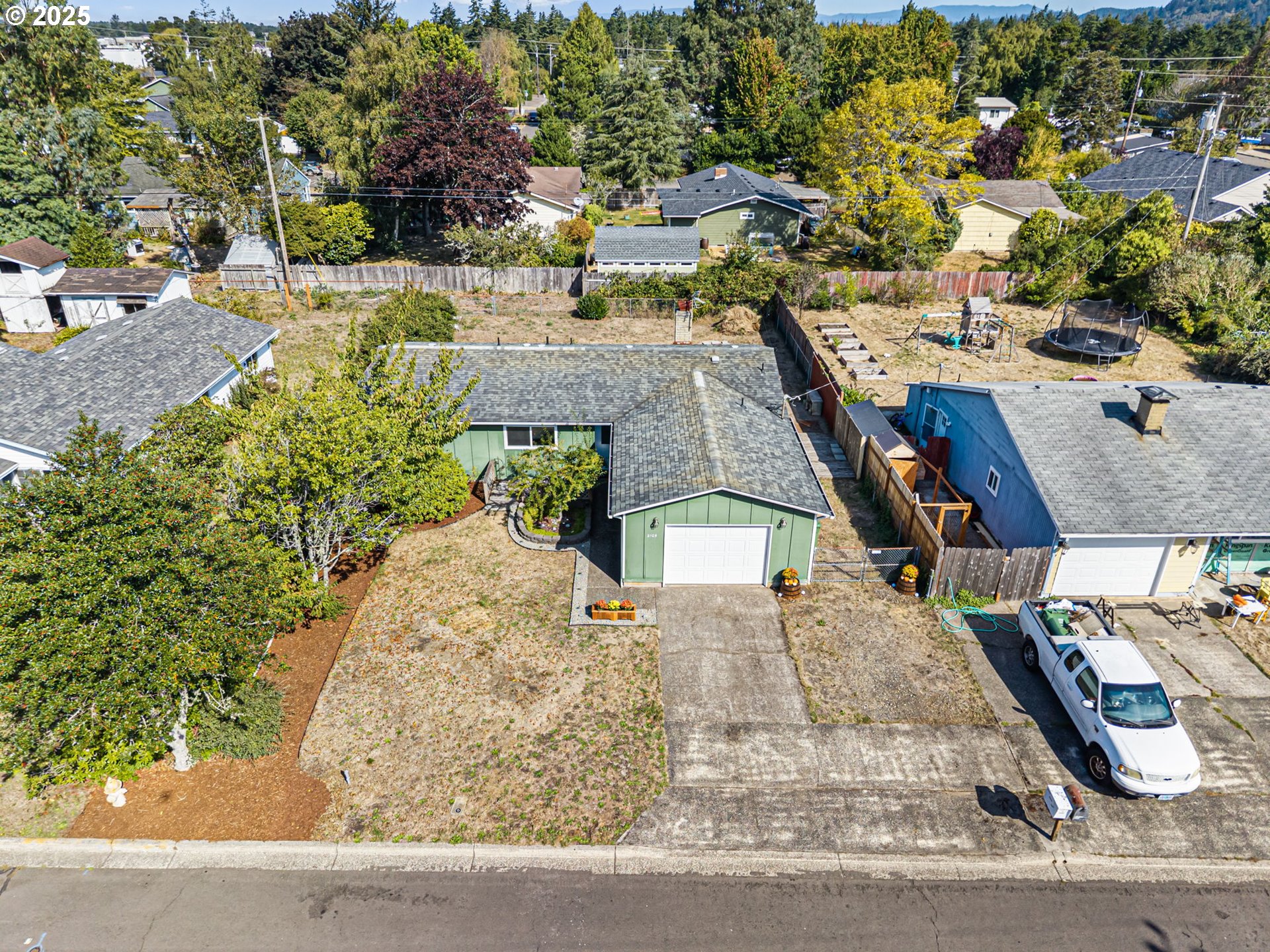 2105 16th Street Florence, OR 97439 - Photo 3 of 48 an aerial view of a house with outdoor space