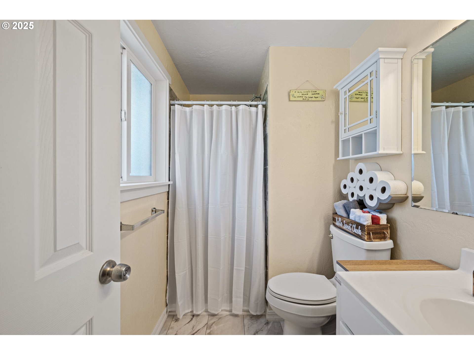 2105 16th Street Florence, OR 97439 - Photo 35 of 48 a bathroom with a sink toilet and shower