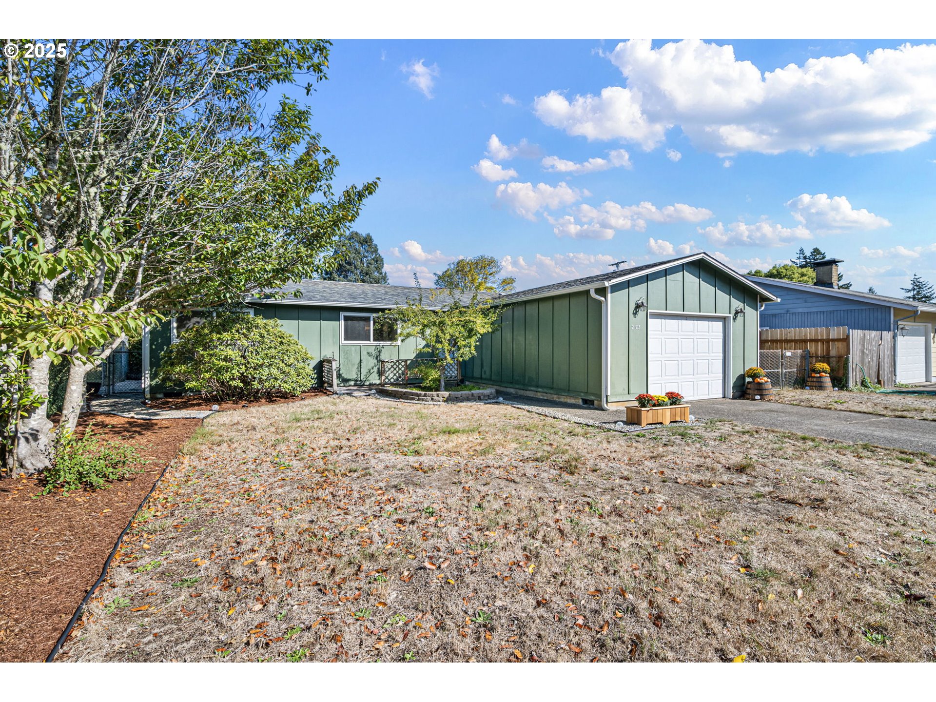 2105 16th Street Florence, OR 97439 - Photo 36 of 48 a front view of a house with garden