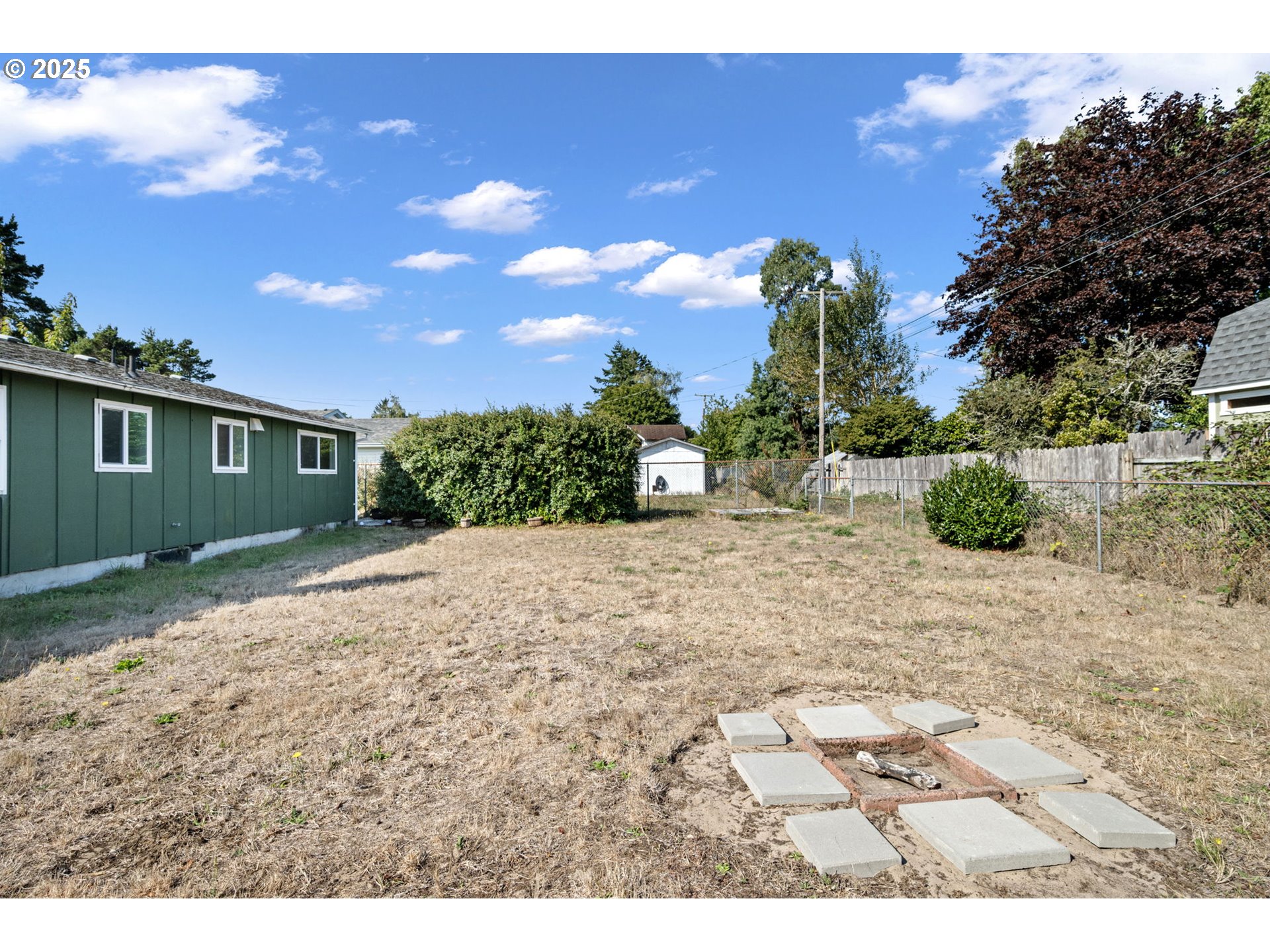 2105 16th Street Florence, OR 97439 - Photo 42 of 48 a view of a backyard of the house